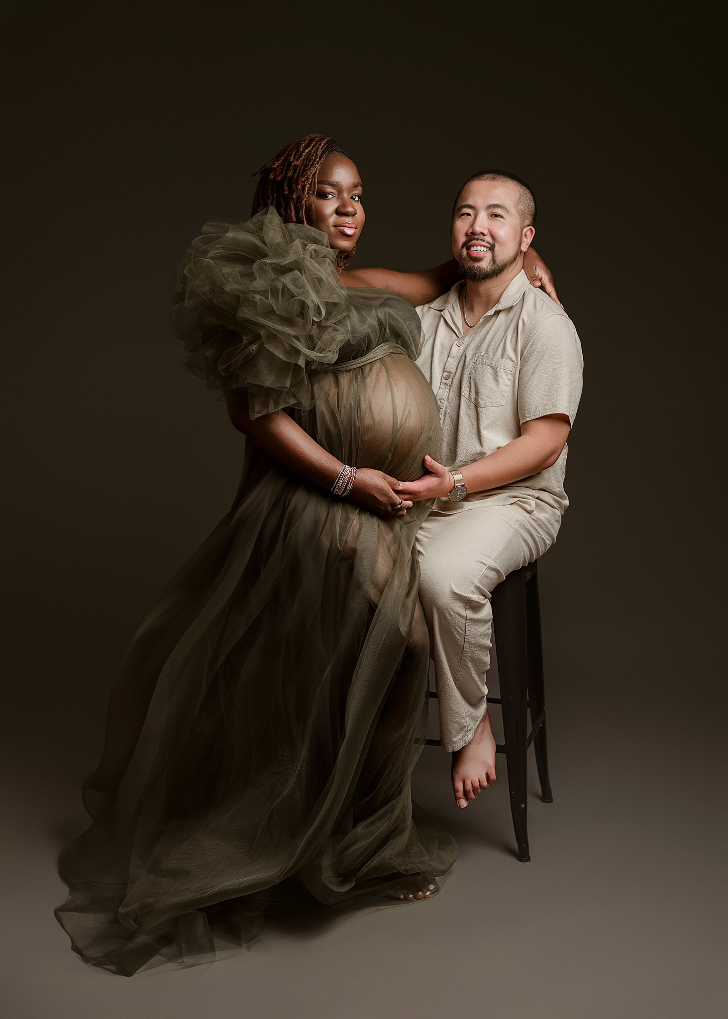 parents posed for professional maternity portraits, full service maternity, professional makeup photoshoot