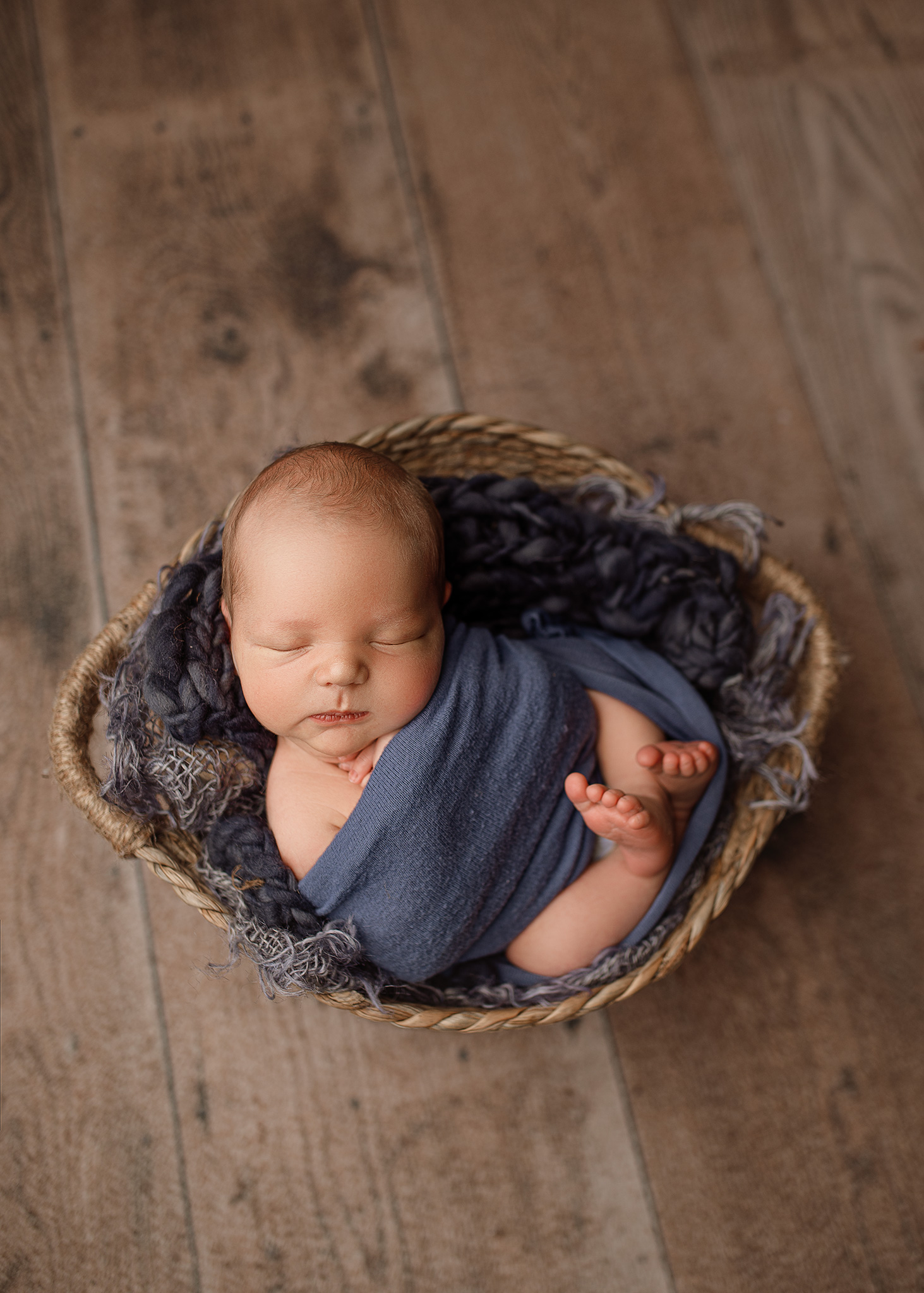 BFP_2756 newborn boy in blue professionally photographed in nebraska studio